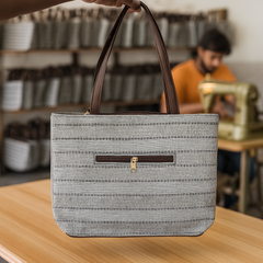 Elegant Beige Textured Handbag with Brown Handles